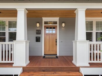 Covered Porch And Front Door Of Beautiful New Home