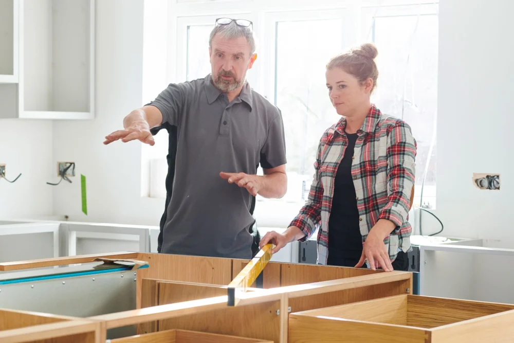 Homeowner And Contractor In A Kitchen Remodel